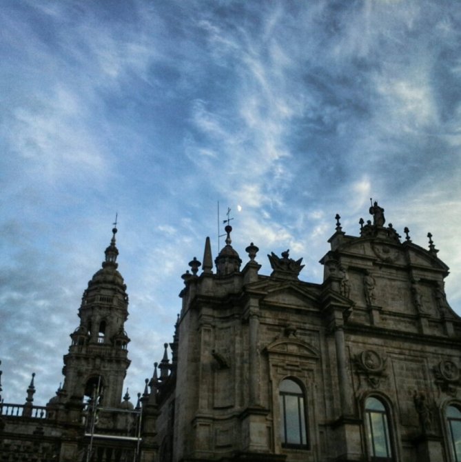 Historic building with ornate architecture against a cloudy sky